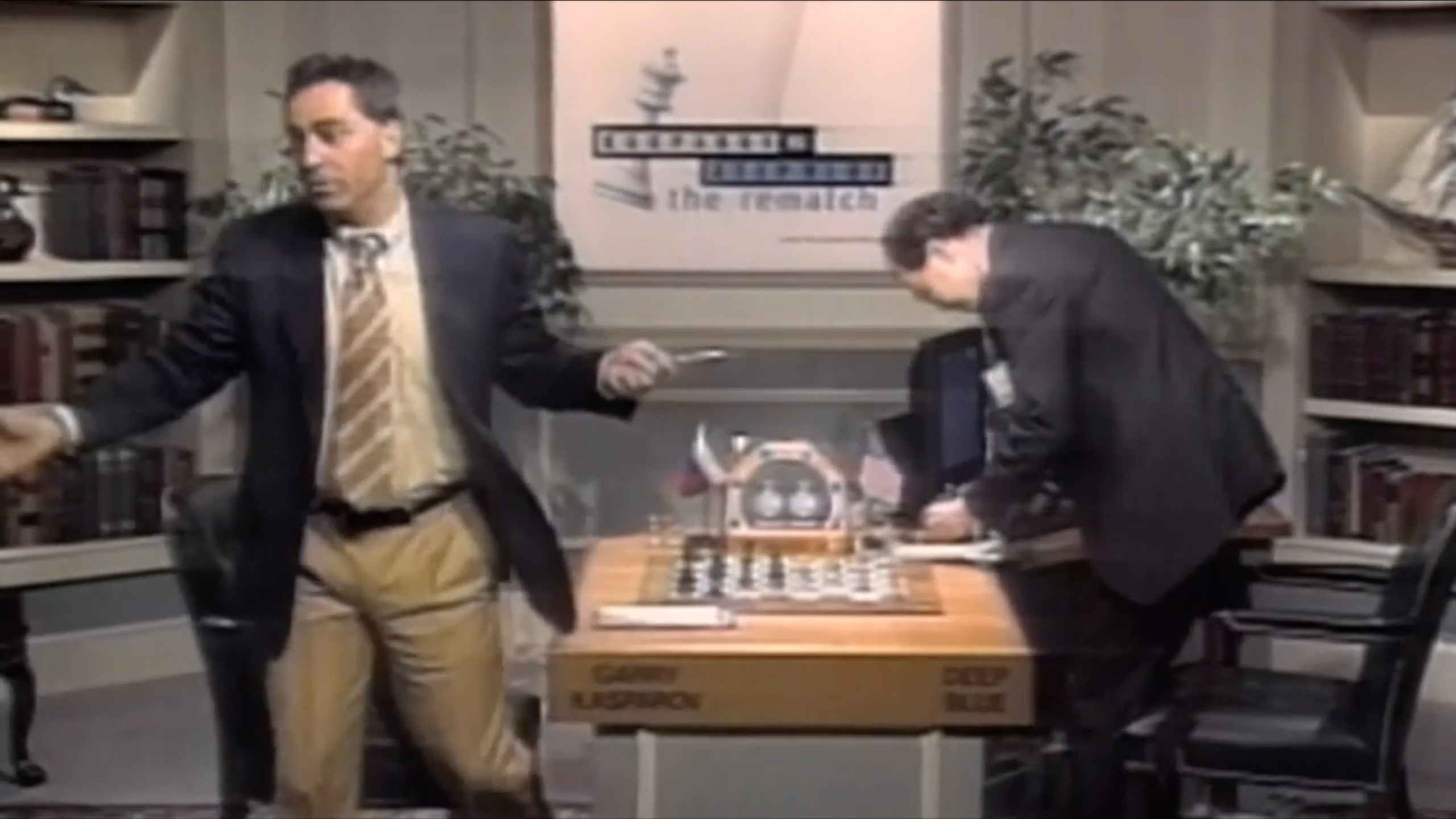 Still photo of Garry Kasparov resigning in his final game versus Deep Blue