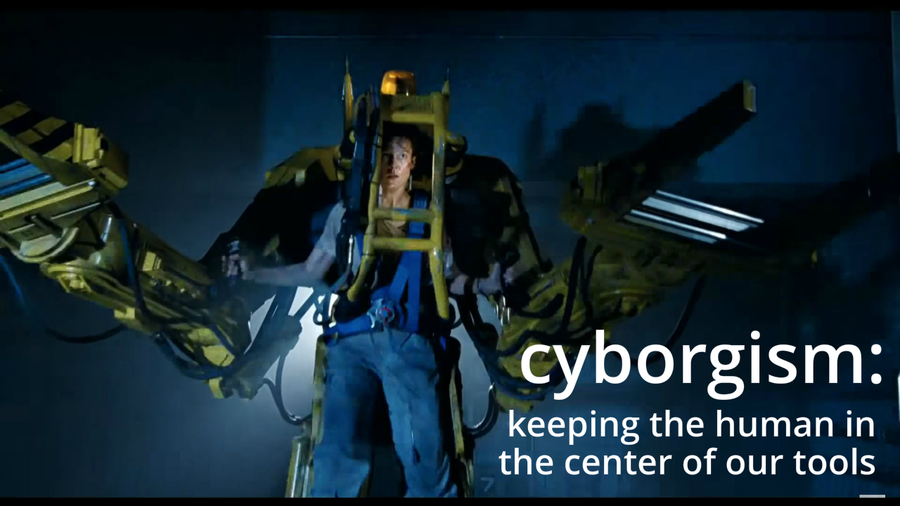 Screenshot of Sigourney Weaver in the Power Loader. Caption: cyborgism, keeping the human in the center of our tools